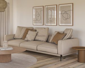 Moderne billedvæg med tre abstrakte line art plakater i beige og sort