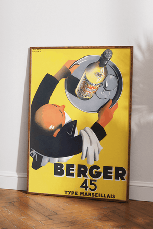 Vintage Banania plakat med smilende mand og ske – fransk retroreklame i gule og røde farver med teksten "Petit Déjeuner Familial".