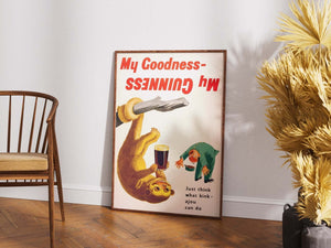 Vintage Guinness plakat med kinkajou, der holder en øl, og teksten “My Goodness – My Guinness” i retrostil.

