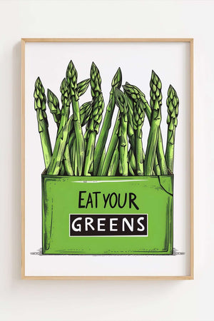 Køkkenplakat med grønne asparges og teksten "Eat Your Greens" i en træramme – sjov og farverig vægdekoration til køkkenet.