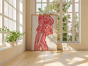 Rød figurplakat med organiske linjer og grafisk balance på lys baggrund i træramme