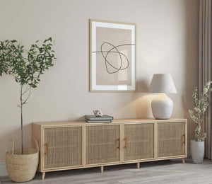 Moderne billedvæg med tre abstrakte line art plakater i beige og sort