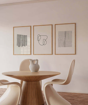 Minimalistisk billedvæg med tre moderne line art plakater i sort og hvid
