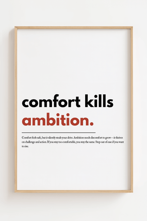 Motiverende plakat med teksten comfort kills ambition hvor ambition er fremhævet i rød.