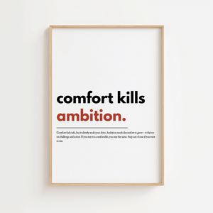 Motiverende plakat med teksten comfort kills ambition hvor ambition er fremhævet i rød.