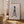 Walking Lady Lagom plakat med minimalistisk illustration af kvinde i grøn bluse og stribet nederdel.