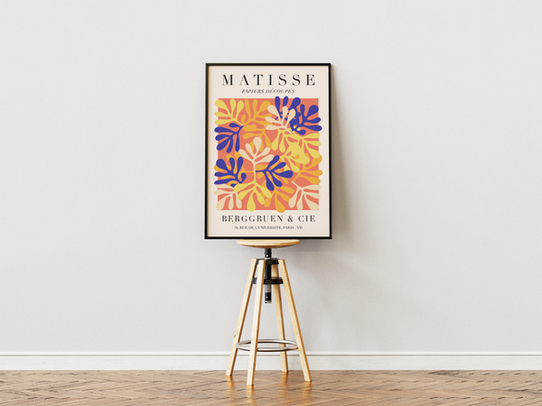 Colorful Paper Shapes Matisse plakat med farverige cut-out blade i blå, gul og orange.