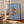 Oranges on Blue plakat med appelsiner på blå ternet baggrund – moderne frugt- og køkken plakat.