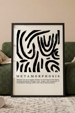 Metamorphosis abstrakt plakat med sorte penselstrøg i spiralformede bevægelser i egetræsramme ved sofa