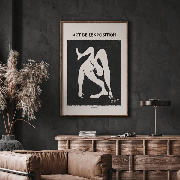 Picasso plakat med sort-hvid stregtegning af akrobatisk figur.

