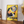 Vintage Banania plakat med smilende mand og ske – fransk retroreklame i gule og røde farver med teksten 